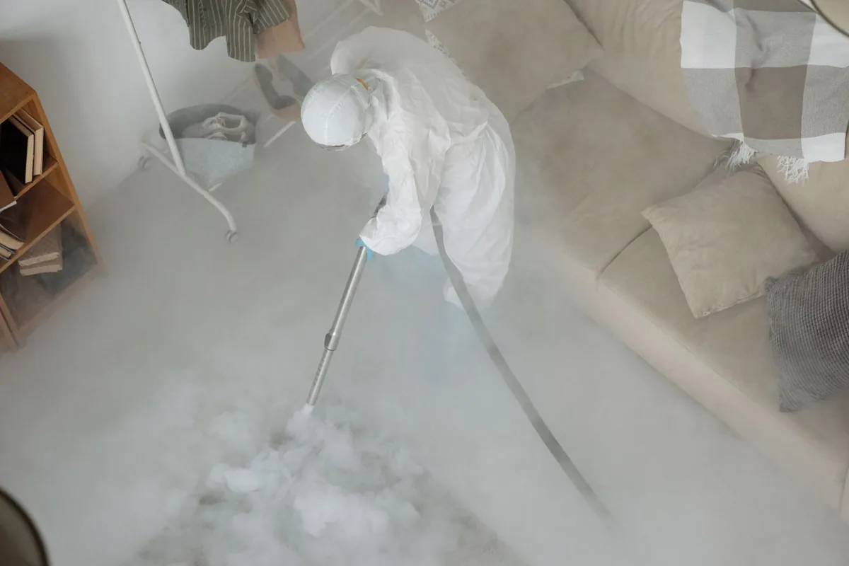 Biohazard cleanup technician in protective equipment, Tripoli Park, Milwaukee, WI